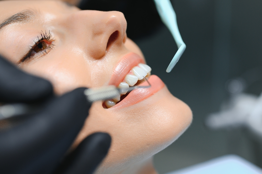 Dentist and dental props working in a dental office, dental props and dentist posing for a photo.