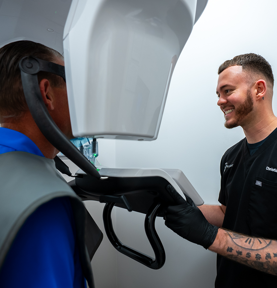 staff member monitoring patient in a CBCT scan